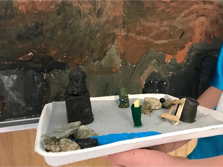 Working on a diorama of the southwest .